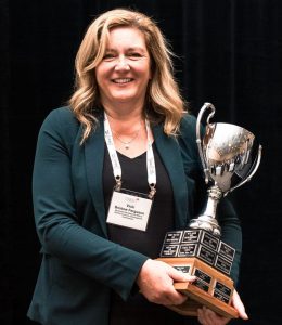 Vicki Bristow Ferguson holding the Ontario East's Economic Development Officer of the Year Award